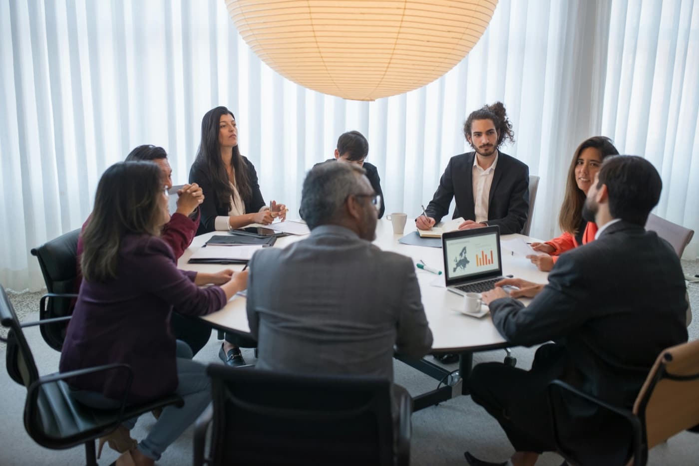 Diverse team collaborating around a table